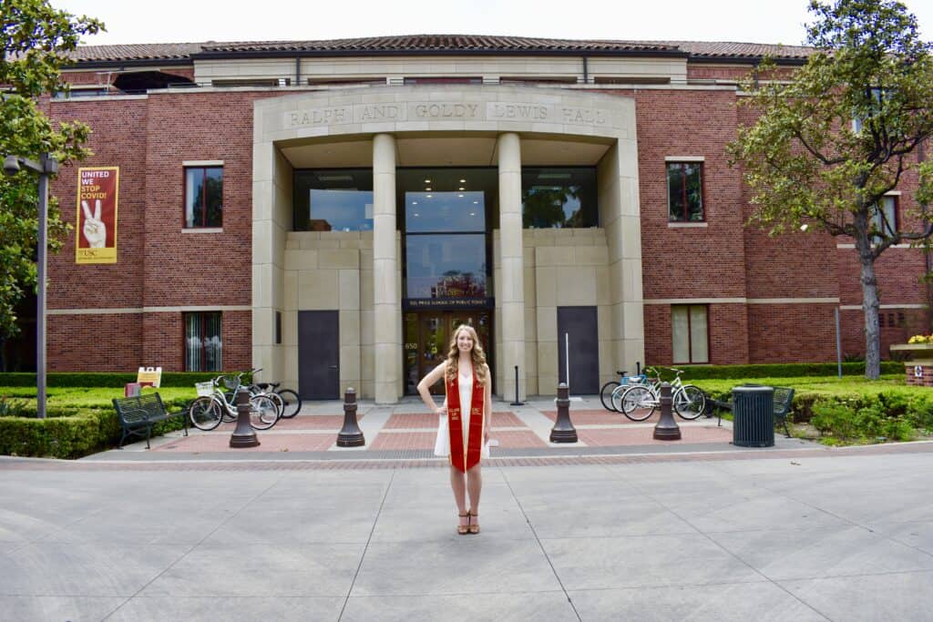 Sabrina Panfil in front of Ralph and Goldy Lewis Hall