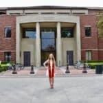 Sabrina Panfil in front of Ralph and Goldy Lewis Hall