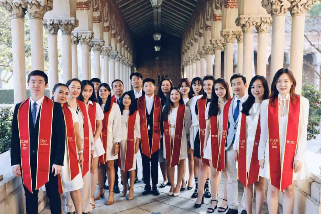 A group of IPPAM students in gradation sashes