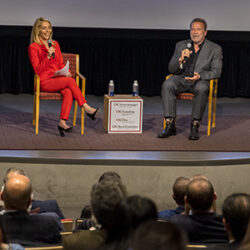 Terminate Hate event, showing Gov. Arnold Schwarzenegger and CNN Chief Political Correspondent Dana Bash on stage together.