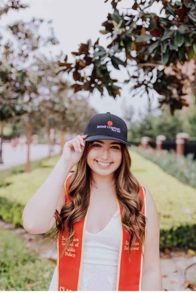 Ally Sanchez on the USC campus wearing Irvine Company hat