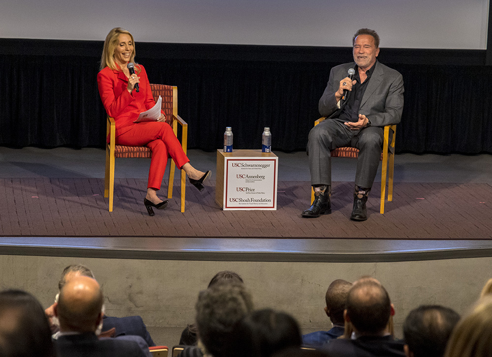 Terminate Hate event, showing Gov. Arnold Schwarzenegger and CNN Chief Political Correspondent Dana Bash on stage together.