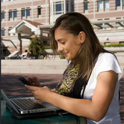 Woman on a laptop on campus