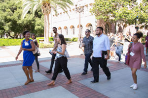 USC Price Ph.D. student Breanna Morrison, left, leads a tour of the USC campus as part of the workshop. (Photo by David Giannamore)