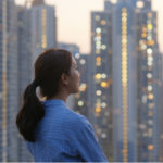 Woman looking at a city skyline