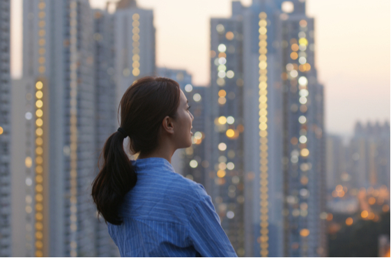 Woman looking at a city skyline