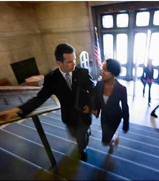 Public officials walking up stairs