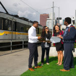 Urban planning students near a train