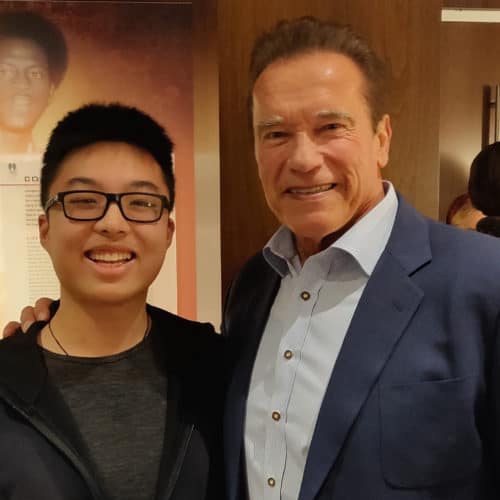 Victor Qiu and former Gov. Arnold Schwarzenegger