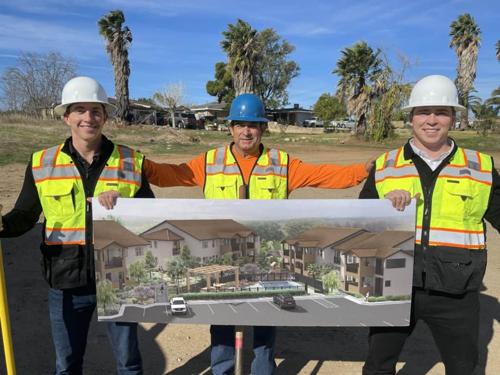 Matt Walters (left), general contractor Joe Martinez (center) and James Walters (right) at the construction site of Pinebrook Apartment Homes in Riverside.
