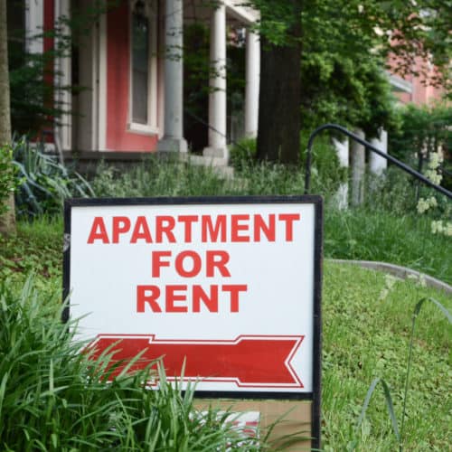 image of a house with sign saying Apartment for Rent