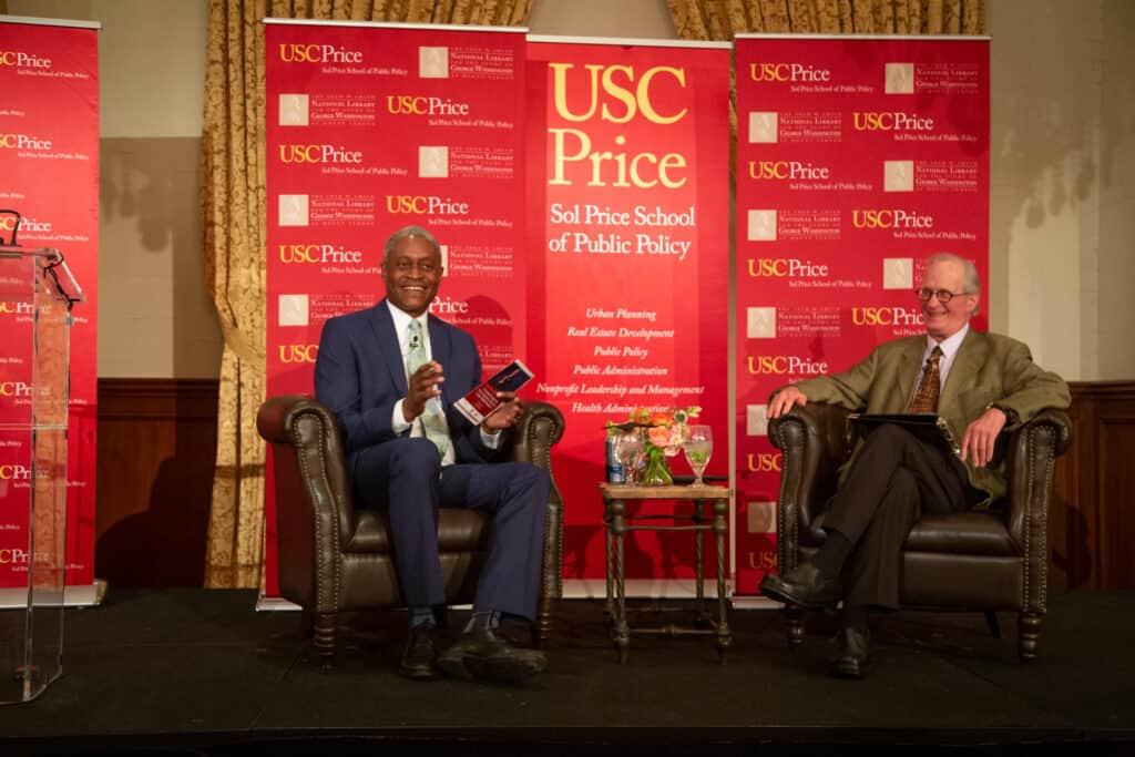 Raphael Bostic and David Sloane on stage at USC Town and Gown