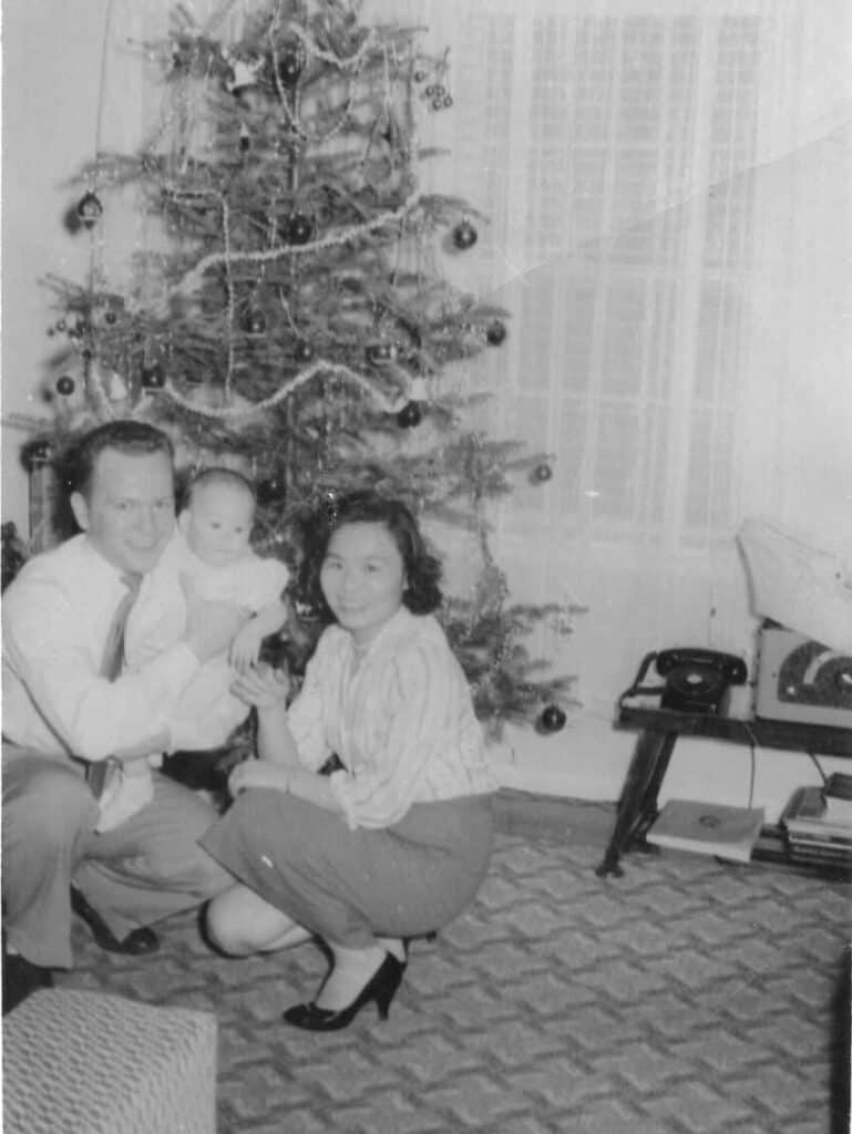 Jim and Yaiko Mann with 8-month-old Joyce, December 1957.