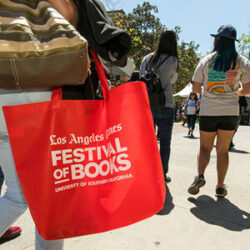 Red tote bag with Los Angeles Times Festival of Books logo