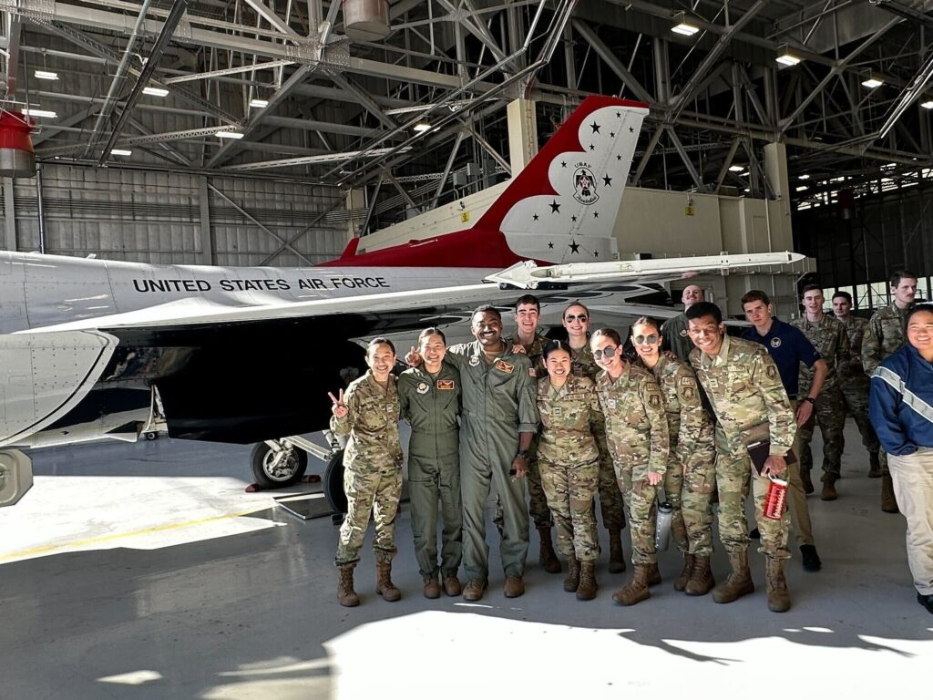 AFROTC students posing in front of a United States Airforce aircrafts
