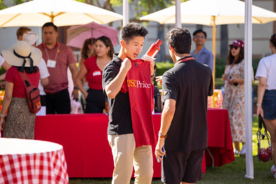 student with Price School branded t-shirt at welcome back bbq