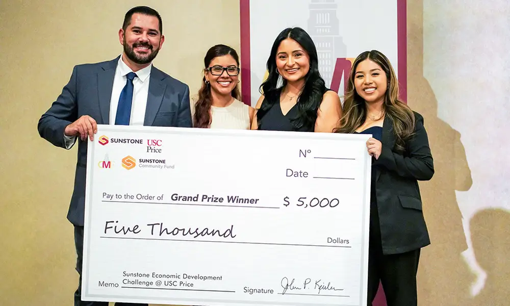 The winners of the Sunstone Challenge pose for a photo with a giant check