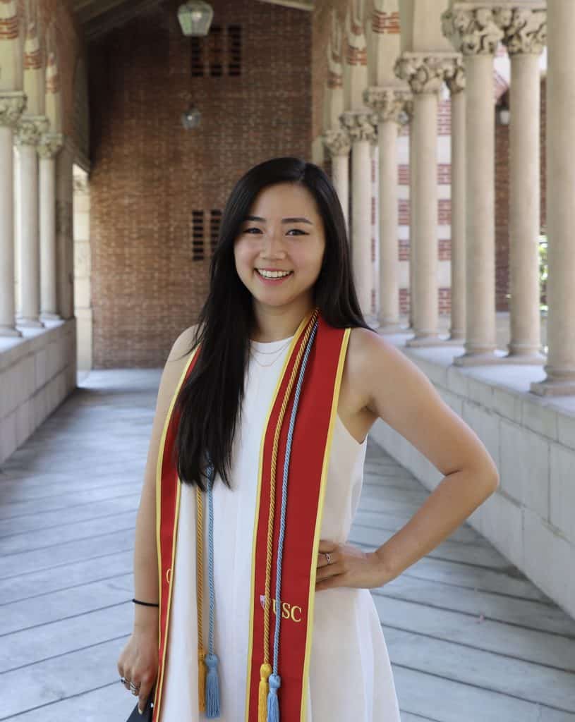 Katie Lee standing graduation photo