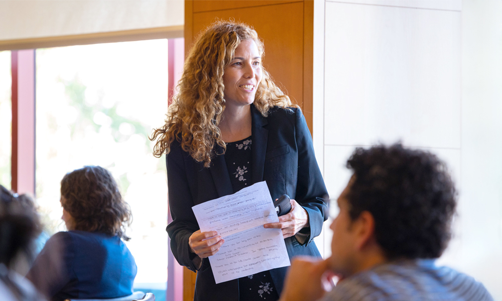 Emma Aguila speaks in a classroom