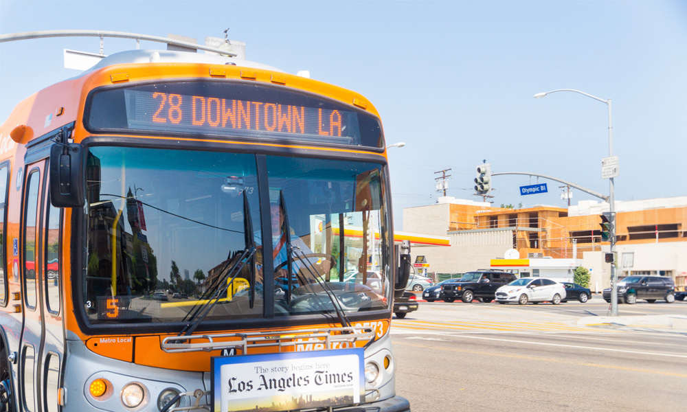 a Los Angeles metro bus drives down a road