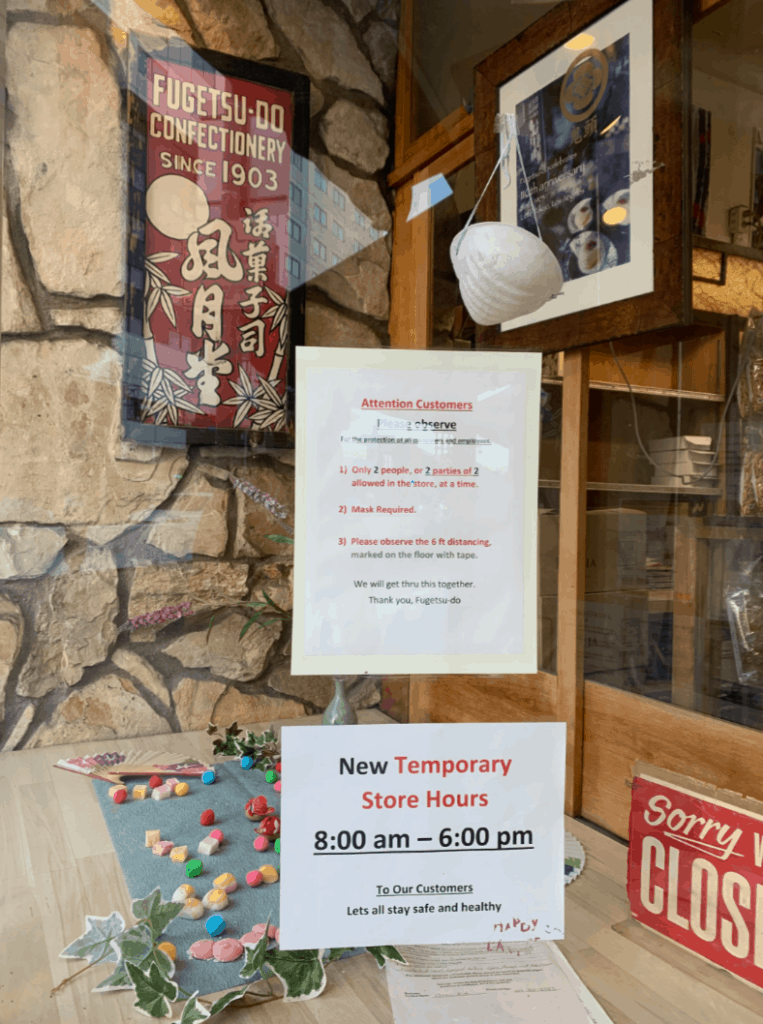 Printed signs in a Little Tokyo store window