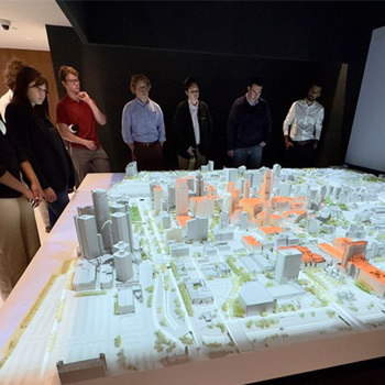 Students look at model of Detroit