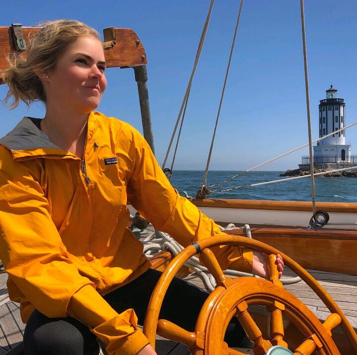 Girl at the wheel in yellow shirt