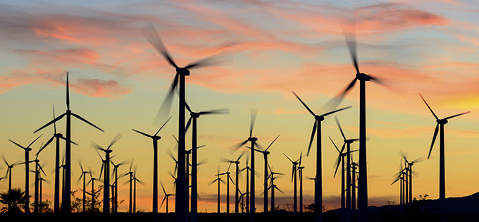 Wind farm in silhouette at dusk