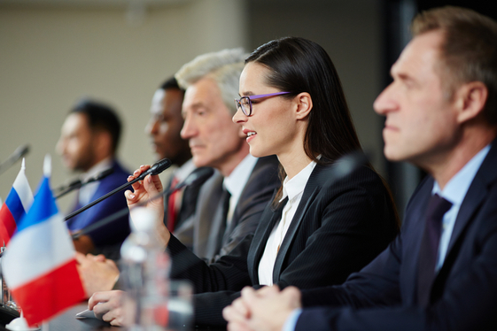 Woman speaking on a panel. 