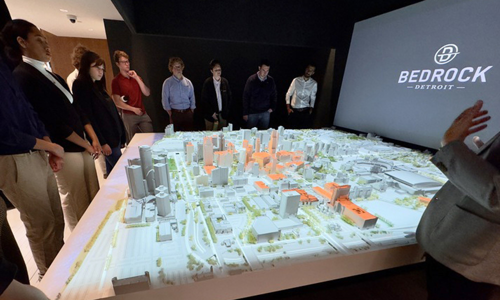 Students look at a 3-D model of downtown Detroit during their Maymester trip to the Motor City.