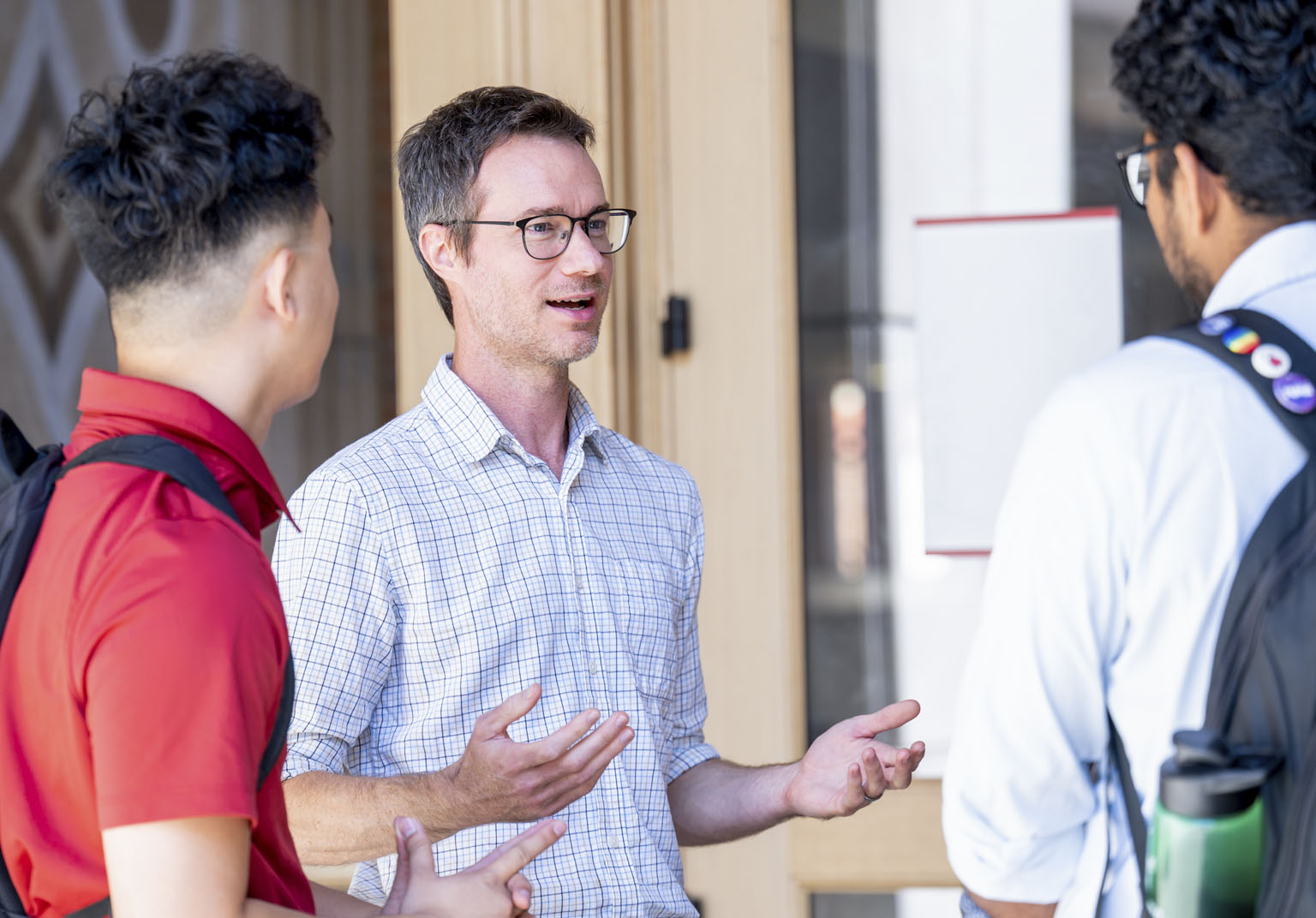 Professor talking to a group of students