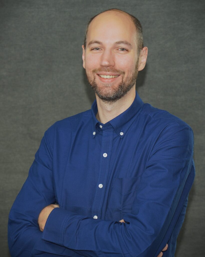 headshot of Andre Comandon