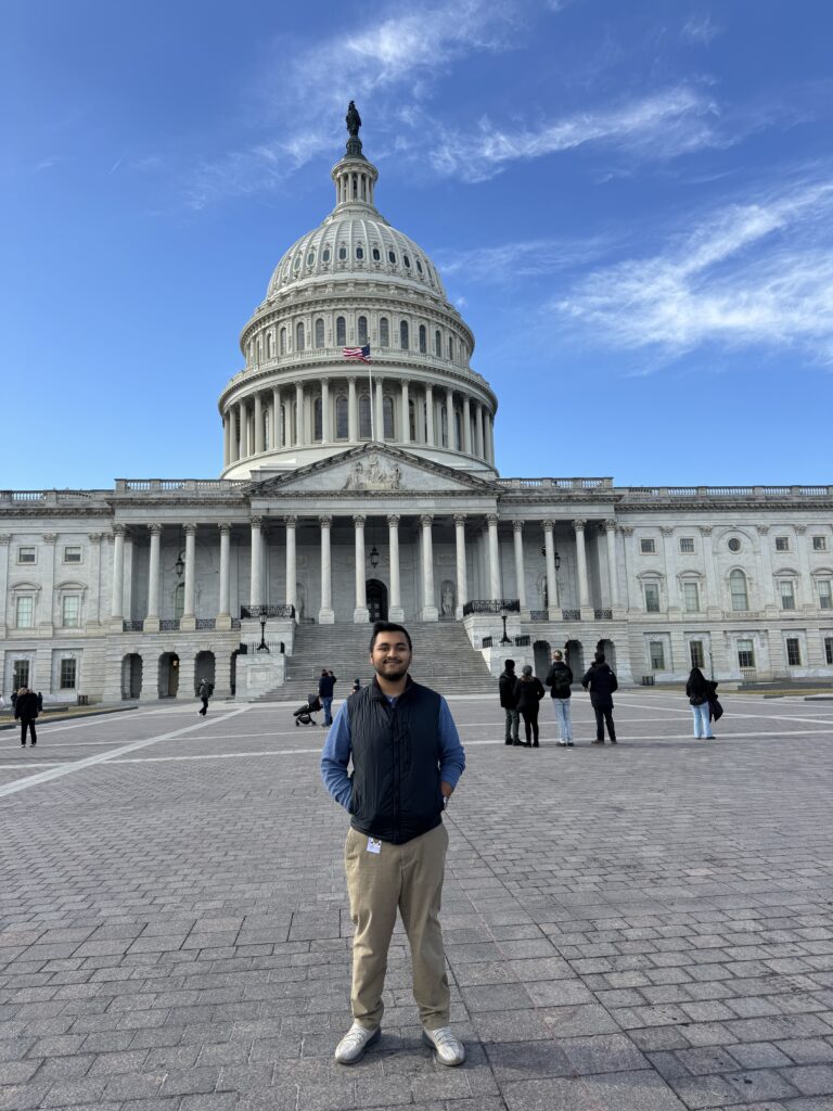 DC Student in front of capitol building.
