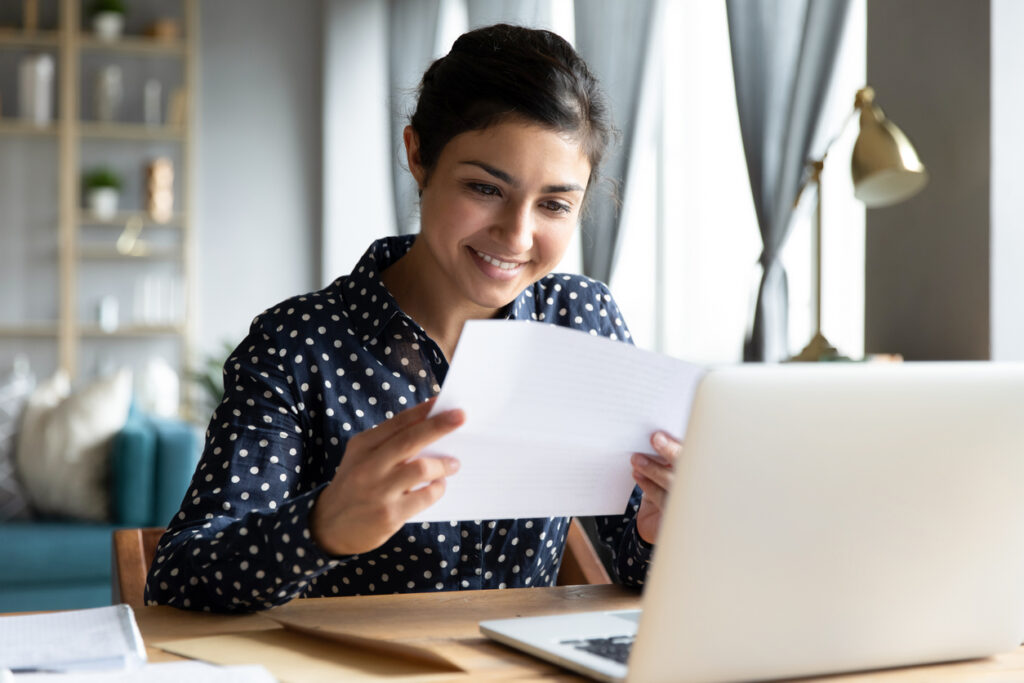 Women reading a letter for recommendation for graduate school