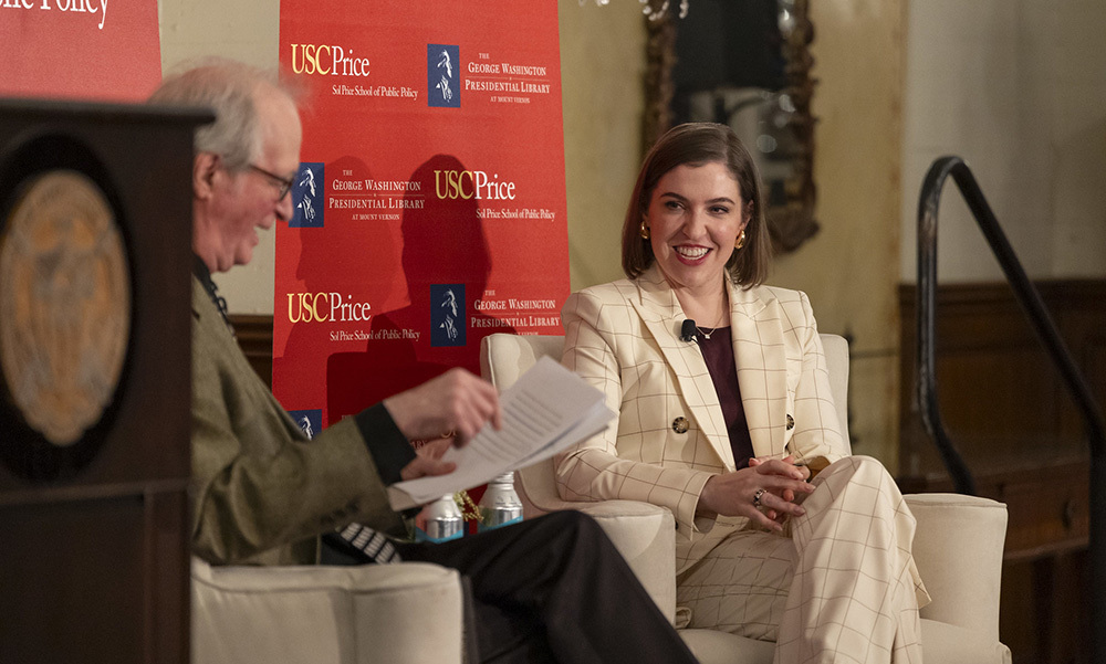 Lindsay Chervinsky sits on stage in conversation with David Sloane (left)