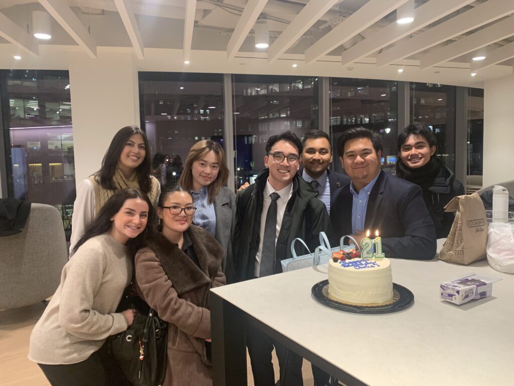 Students in DC around a birthday cake