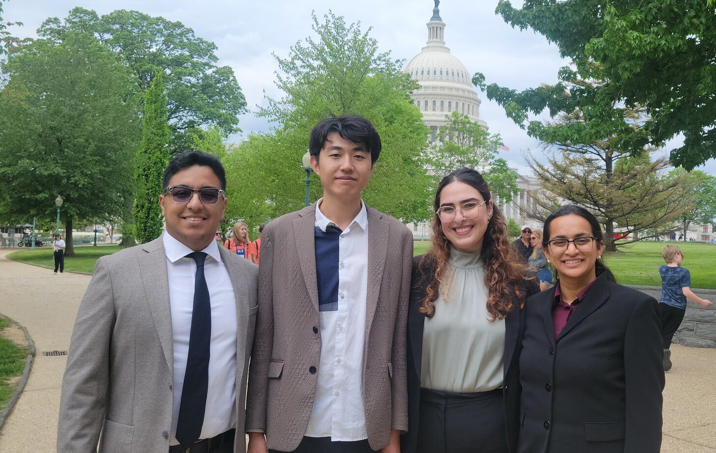From left, MPP students Gerson Montes, Weihang Zhang, Caroline Ghanbary, and Drishti Baid pose in front of the U.S. Capitol.