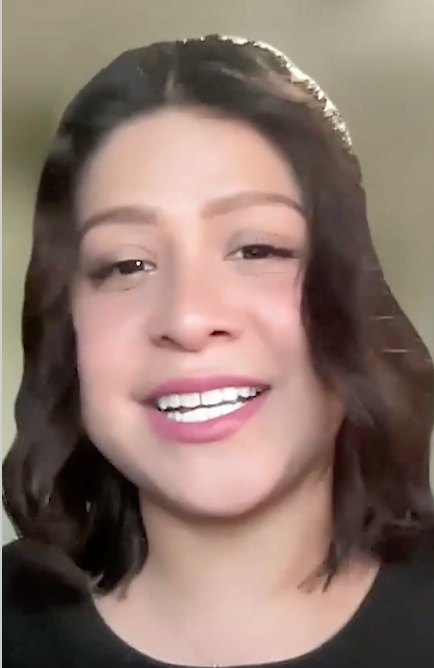 Woman with shoulder length brown hair smiling.